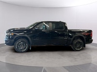 Experience the 2027 Ram 1500 Rebel in stunning black with robust 44 capabilities. This new truck del... (image 1)