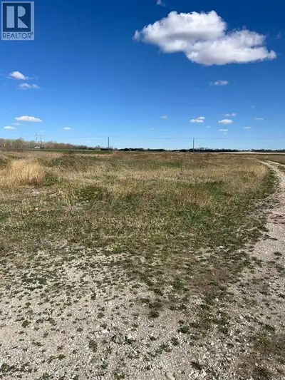 COME build your dream home....!!!! Right on Glenmore Trail only 5 miles from the City Limit.... this...