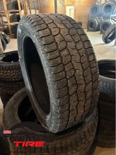 SET OF FOUR USED COOPER SNOW CLAW WINTER TIRES 55% TREAD REMAINING AT 8/32NDS. 285/45R22 SOLD AS SET...