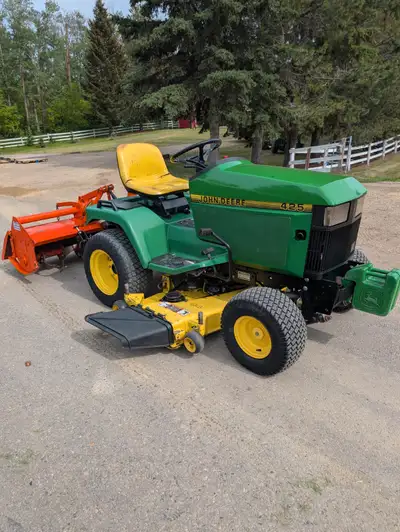 John Deere 425 with mower deck and rototiller, View more