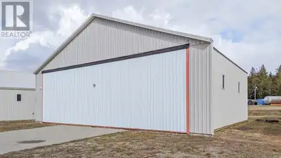 Creston Airport Hanger! 54' by 50' Hanger with 16'10"" hydraulic door located on paved access to Air...