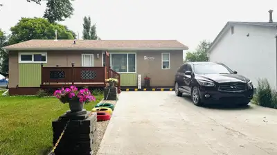 B11//Brandon/Welcome to this well-maintained 6-bedroom, 2-bathroom bungalow, featuring a mother-in-l...