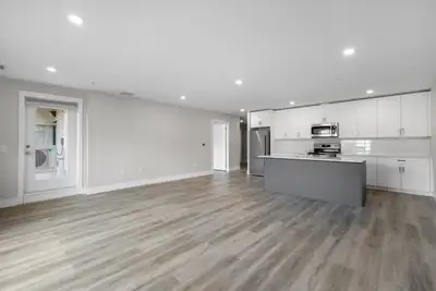 1 Bedroom + Den Elation Suites - Plan B Step into a modern living room designed to enhance your life...