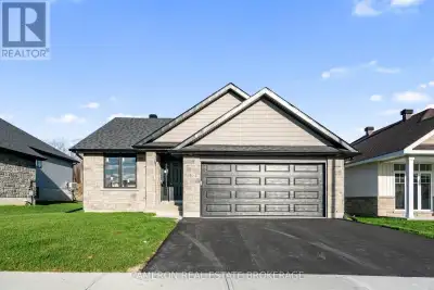 BRAND NEW BUNGALOW! Are you in the market for a stunning ground level entry bungalow with an attache...