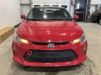 Le Scion tC 2016 usagé proposé par AutoStudio 72 à Mirabel mise sur une conduite engageante avec sa... (image 5)