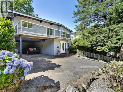 Very desirable Calverhall location! 7000 square foot lot with HUGE Backyard! Lane access. 4 bedrooms...