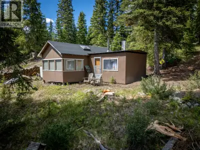 Escape to the tranquility of Paska Lake with this adorably rustic 1-bedroom lakefront cabin set on 0...