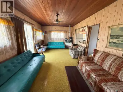Tucked away in the charming lakeside community of Saskatchewan Beach, 407 Idylewylde Avenue is retro...