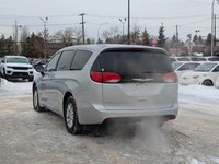 The 2026 Chrysler Grand Caravan SXT in Silver Mist with a Black interior combines versatility, comfo... (image 3)