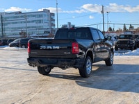 The 2026 Ram 1500 Big Horn Crew Cab in Diamond Black Crystal Pearl combines striking style with adva... (image 6)