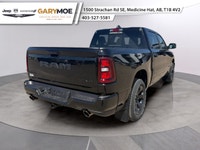 The 2026 Ram 1500 Sport is a striking truck in a bold black finish with a powerful 4x4 drivetrain, p... (image 2)
