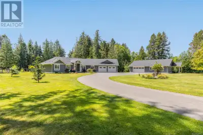 EXQUISITE COUNTRY ESTATE, and ideally located in the beautiful Town of Qualicum Beach. This 2.63 acr...