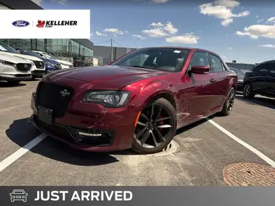 The 2023 Chrysler 300C in Velvet Red Pearl offers a commanding presence with exhilarating performanc...