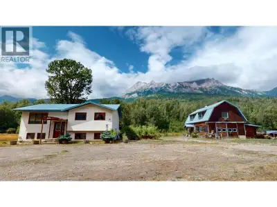 Charming family acreage with stunning mountain views welcomes you to your dream home nestled on 9.58...