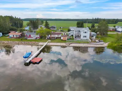 Million dollar view on this renovated lakefront home located on a double lot in the quiet Summer Vil...