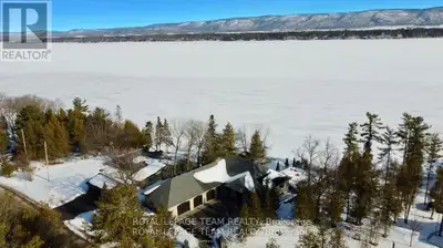 This gorgeous 5 bedroom, 3 bathroom waterfront home is truly one of a kind. Enter into the foyer and...