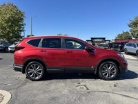 This 2021 Honda CR-V Sport, boasting a vibrant Radiant Red Metallic exterior and a sleek black inter... (image 2)