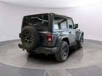 Get ready to command attention with the 2026 Jeep Wrangler Sport, a true symbol of adventure and rug... (image 4)