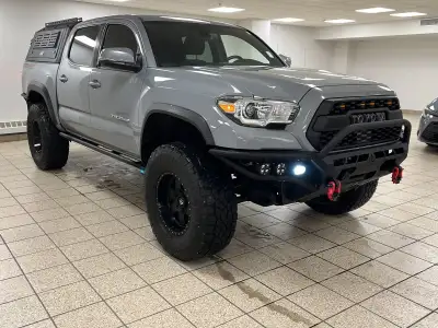 Built to outwork expectations and outplay the weekend, this 2021 Toyota Tacoma in Cement proves capa...