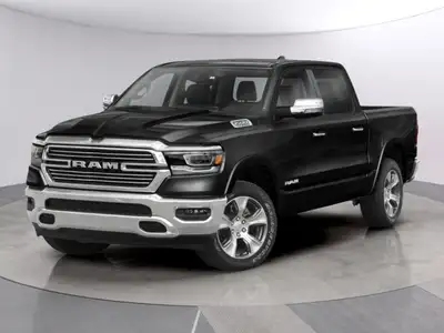 Experience the epitome of power and style with the 2022 Ram 1500 Laramie. This stunning black 4x4 Cr...