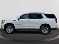 Welcome to Capital GMC! This 2026 GMC Yukon in Glacier White Tricoat is equipped with 4WD and Gas V8... (image 1)