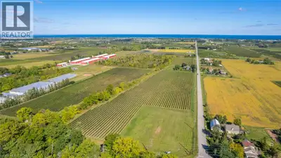 Rare Twenty Valley vineyard offering with 713' of prime frontage along Niagara's renowned Wine Route...