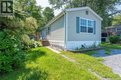 SPACIOUS WELL MAINTAINED MINI.......HOME! Located on a wooded private lot in a cul-de-sac.... it's i...