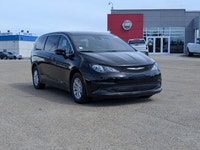 The 2026 Chrysler Grand Caravan SXT in Diamond Black Crystal Pearl with a Black interior offers a bl... (image 7)
