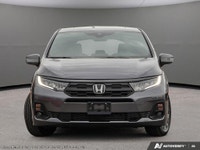 The 2026 Honda Odyssey Touring van in elegant Gray, complemented by a reliable automatic transmissio... (image 1)