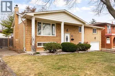 Pride in ownership resides in this well-maintained, all-brick raised bungalow that offers beautiful...