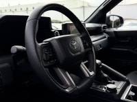The SR5 focuses on utility and versatility, offering a standard three-row configuration and a part-t... (image 4)