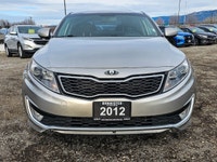 Experience the elegant blend of style and efficiency with the 2012 Kia Optima Hybrid, finished in a... (image 1)