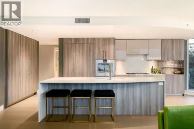 WATERFRONT LUXURY at The Peninsula in Port Royal! 2 bed, 2 bath corner home offers intimate panorami...