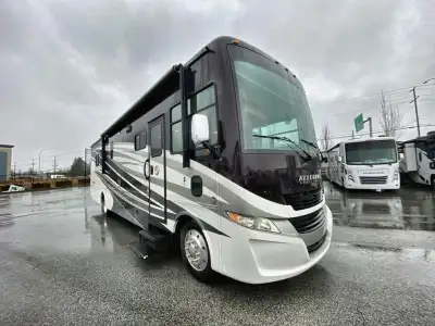 Step into this Allegro 36 LA class A motorhome to find two captain's chairs and overhead cabinets at...