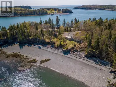 Architecturally Designed Oceanfront Home with Private Beach! Welcome to coastal living at its finest...