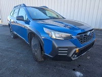 The 2022 Subaru Outback Wilderness in a striking blue finish with an all-wheel-drive system is your... (image 5)