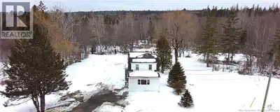 This charming three-bedroom home sits on just over an acre, offering a peaceful escape from the bust...