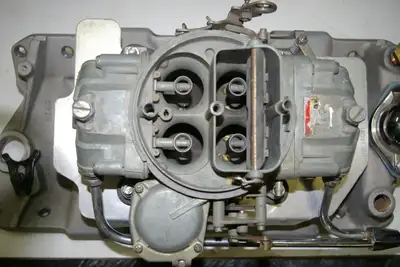 SMALL BLOCK CHEVY WITH 750 HOLLEY CARBURETOR VACUUM SECONDARY, HEAT SPACER PLATE, DUAL CHROME GAS FE...