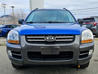 Experience the reliable and versatile 2007 Kia Sportage in a stunning blue finish with front-wheel d... (image 2)
