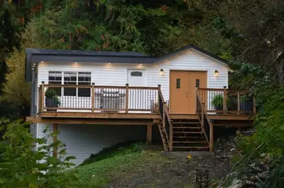 Discover a beautifully renovated 4-bedroom, 2-bath hillside home on 1.1 acres of private, forested l...