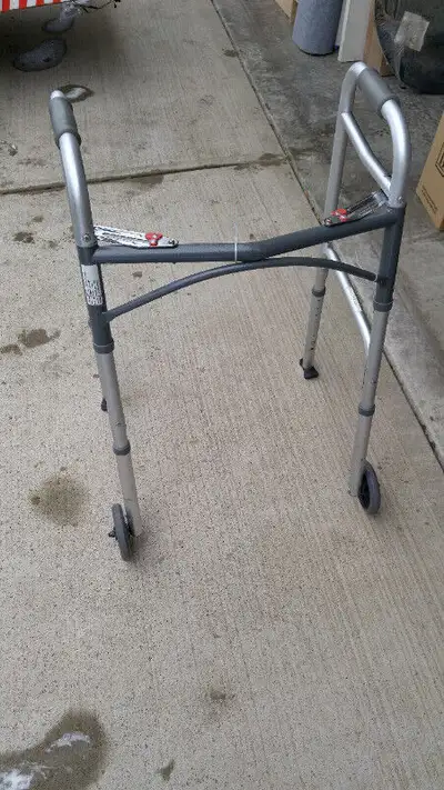 Drive Medical Light Folding Walker with wheels (5 inch), in great condition. max height 41 inch .fir...