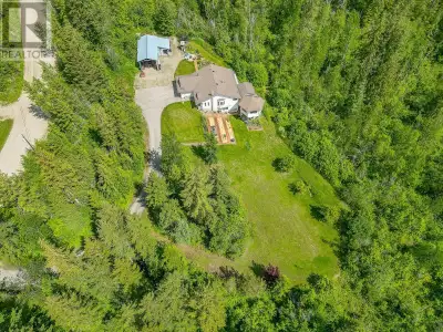 Experience the Best of Country Living Discover your peaceful retreat on 5 beautifully treed acres at...