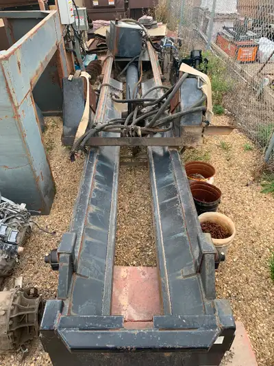 Langfab rolloff hoist for sale. Tandem size. Saddle and lift cylinders are good. Includes pump and s...