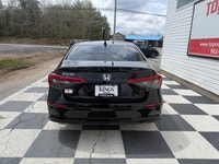 A modern and efficient compact sedan with a refined interior, advanced safety features, and smooth t... (image 4)