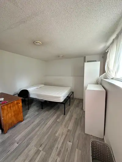 • Spacious private bedroom • Furnished with queen size bed, reading furniture, wardrobe and dresser...