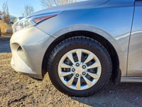 Experience the sophisticated charm of the 2024 Kia Forte LX IVT, presented in a sleek Gray finish wi... (image 4)