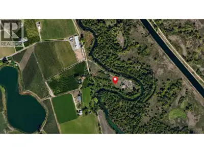 Visit REALTOR website for additional information. Water borders three sides of this nearly 5-acre AG...