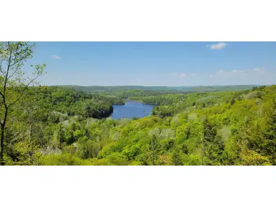 4.54 acre lot located at 12 Ch. du Mica in Val-des-Monts offering a rare "million-dollar" panoramic...