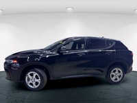 Introducing the 2024 Dodge Hornet GT AWD, a dynamic SUV that commands attention with its black-on-bl... (image 5)