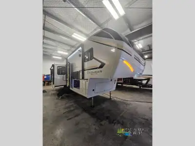 Keystone Cougar Half-Ton fifth wheel 28RLI highlights: Kitchen Island Opposing Slides King Bed Theat...